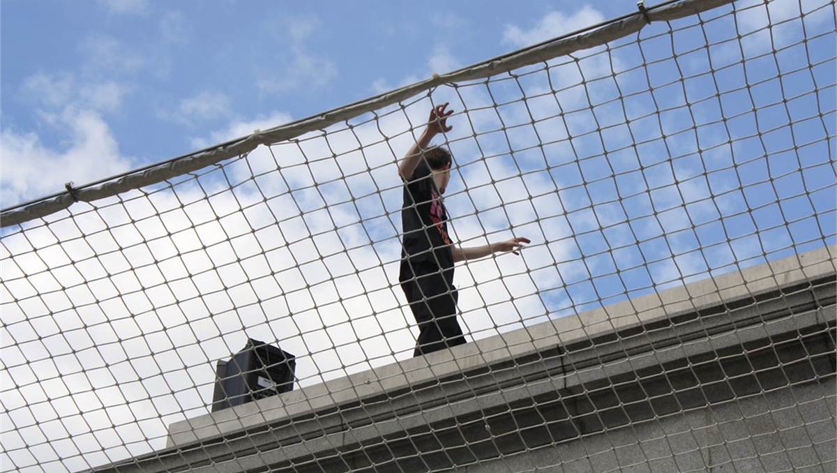 a man walking on a net