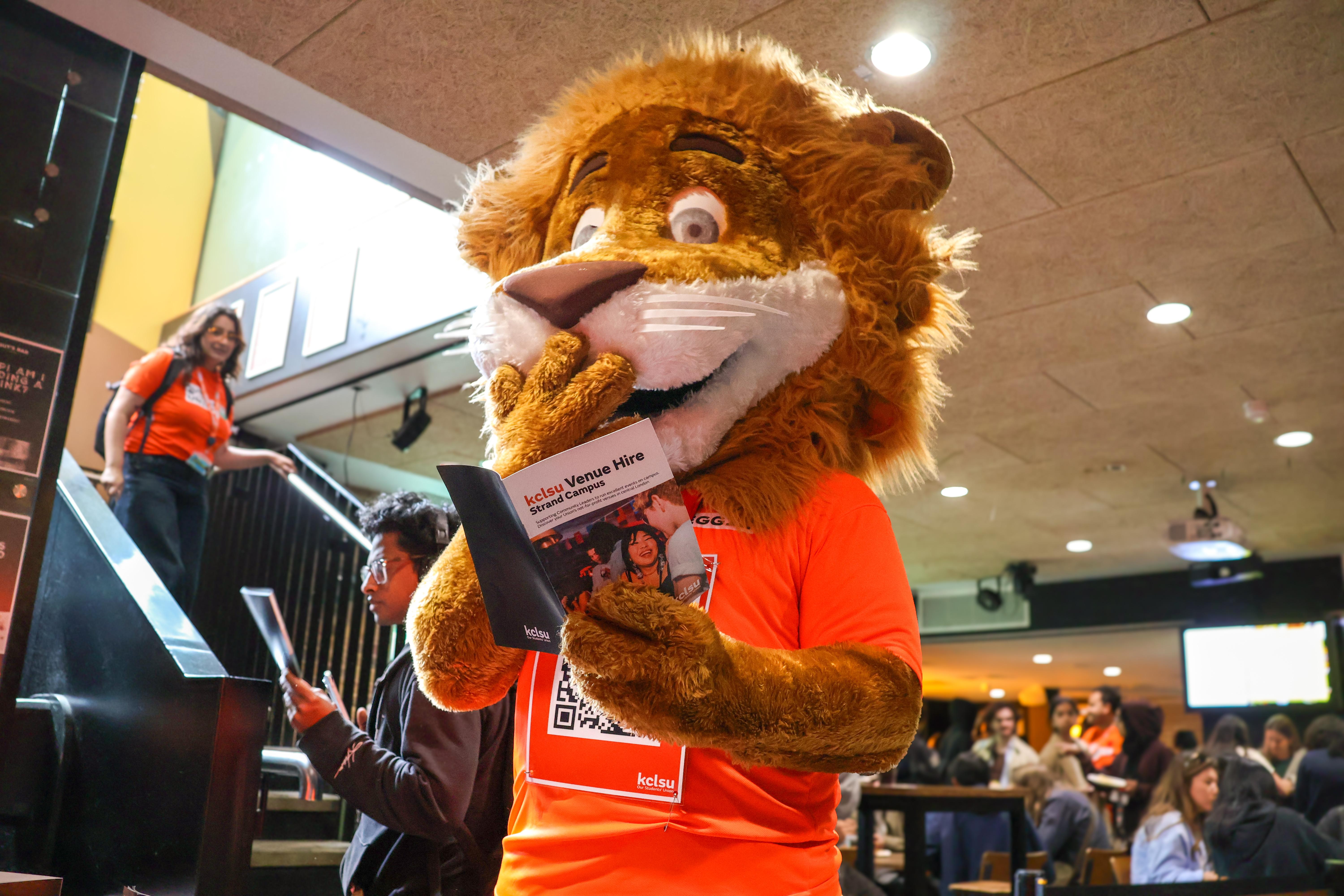 Reggie reading KCLSU guide.