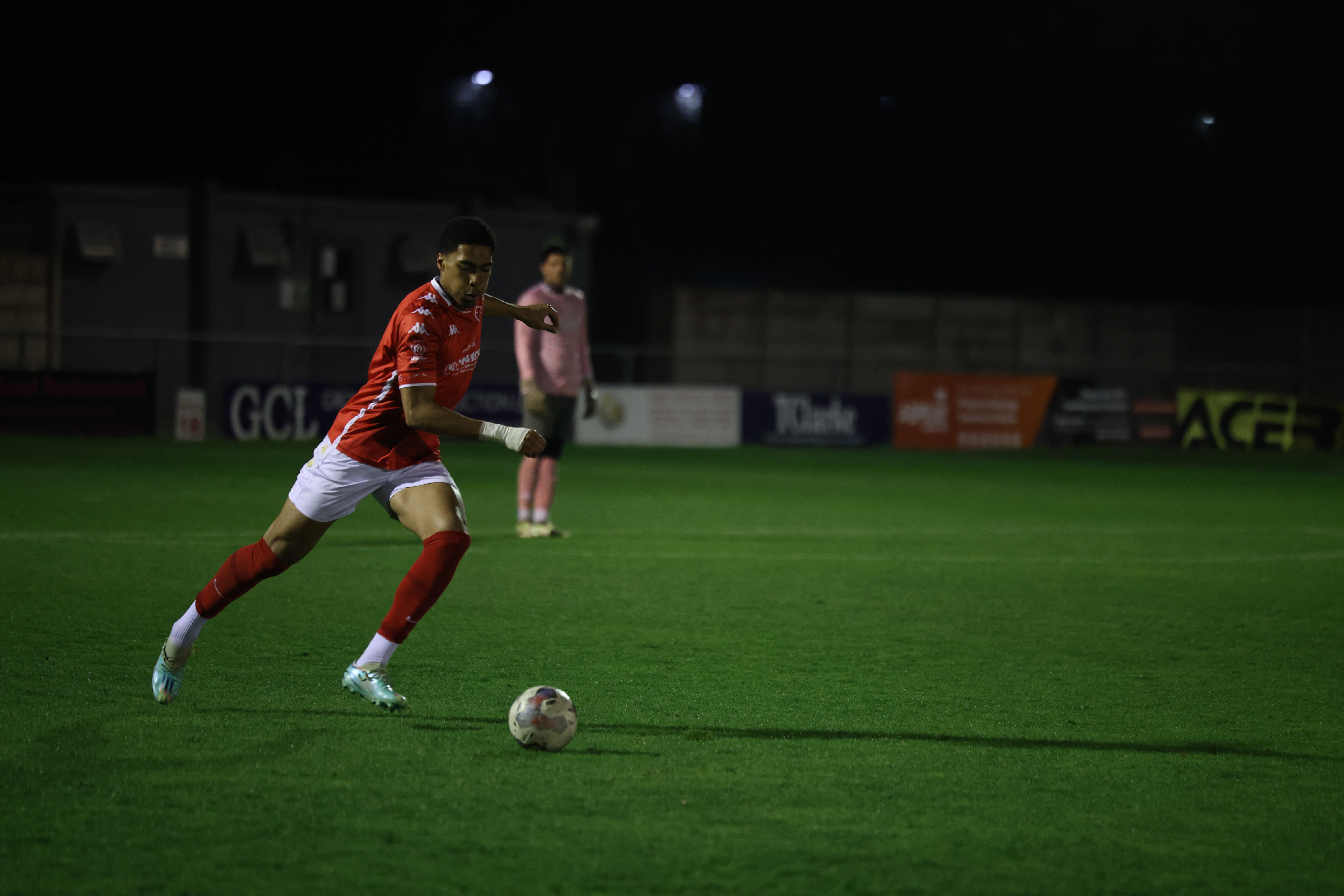 KCL Men's football about to kick the ball.