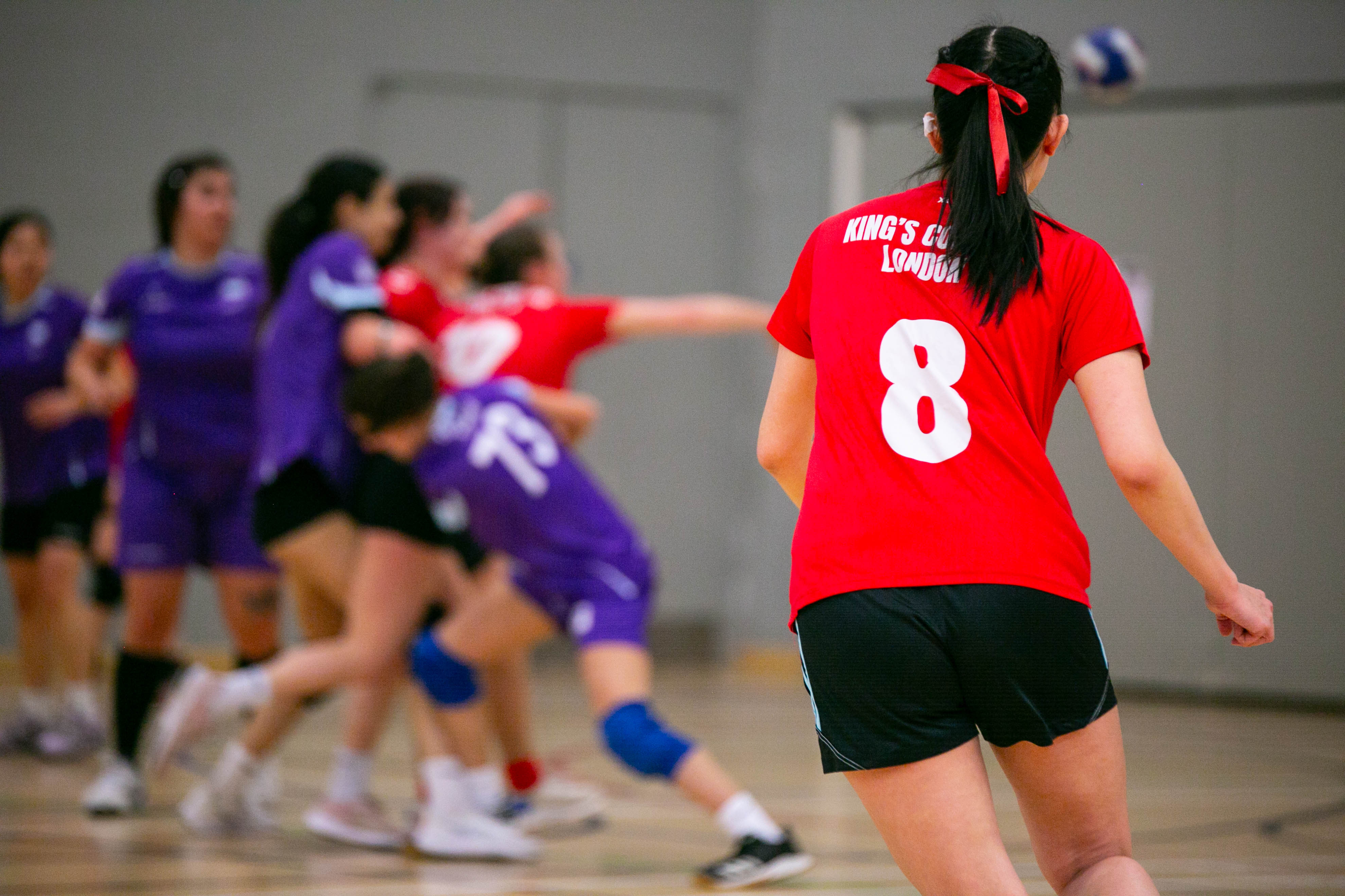 Women's handball playing at varsity.