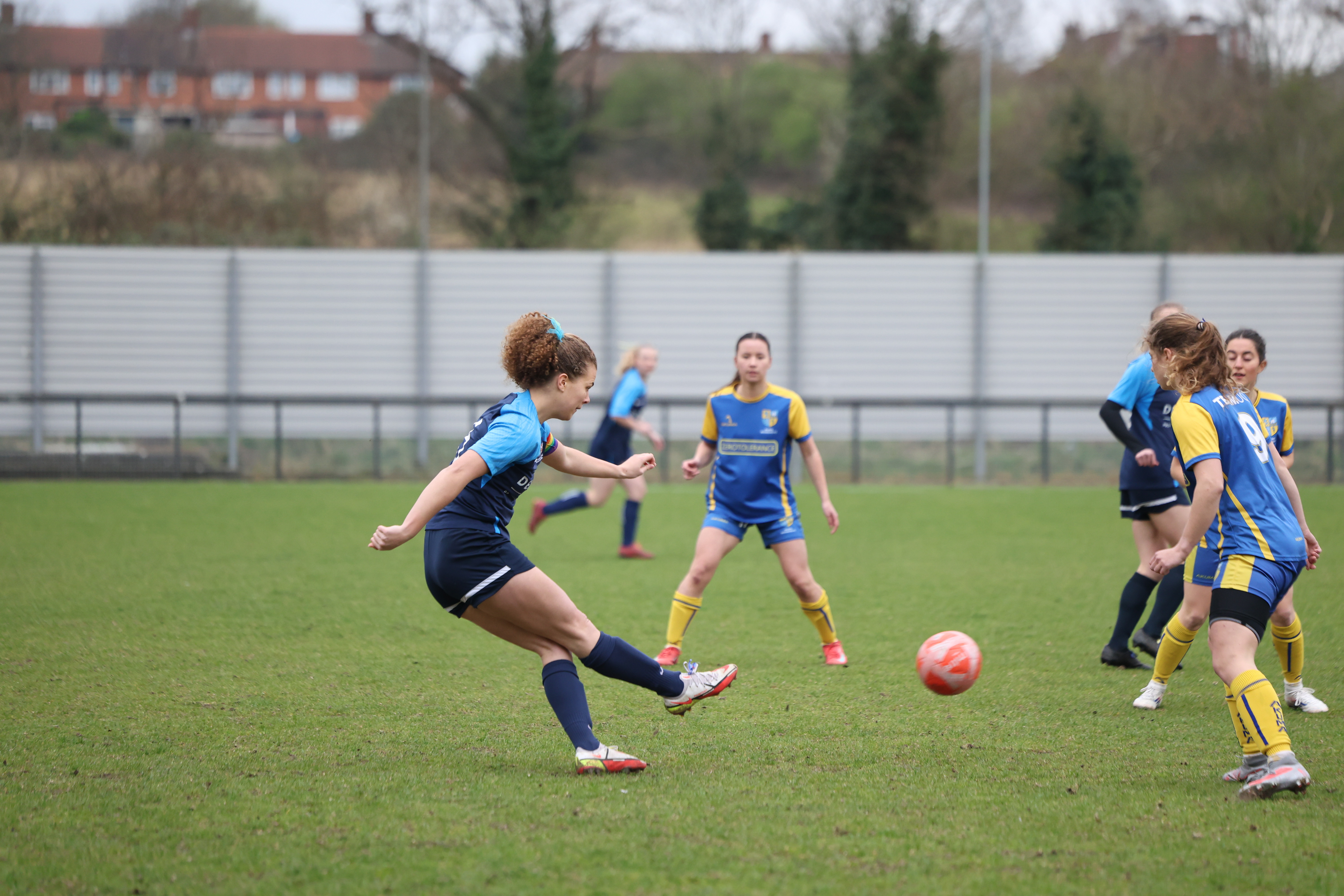 GKT women's football crossing the ball.