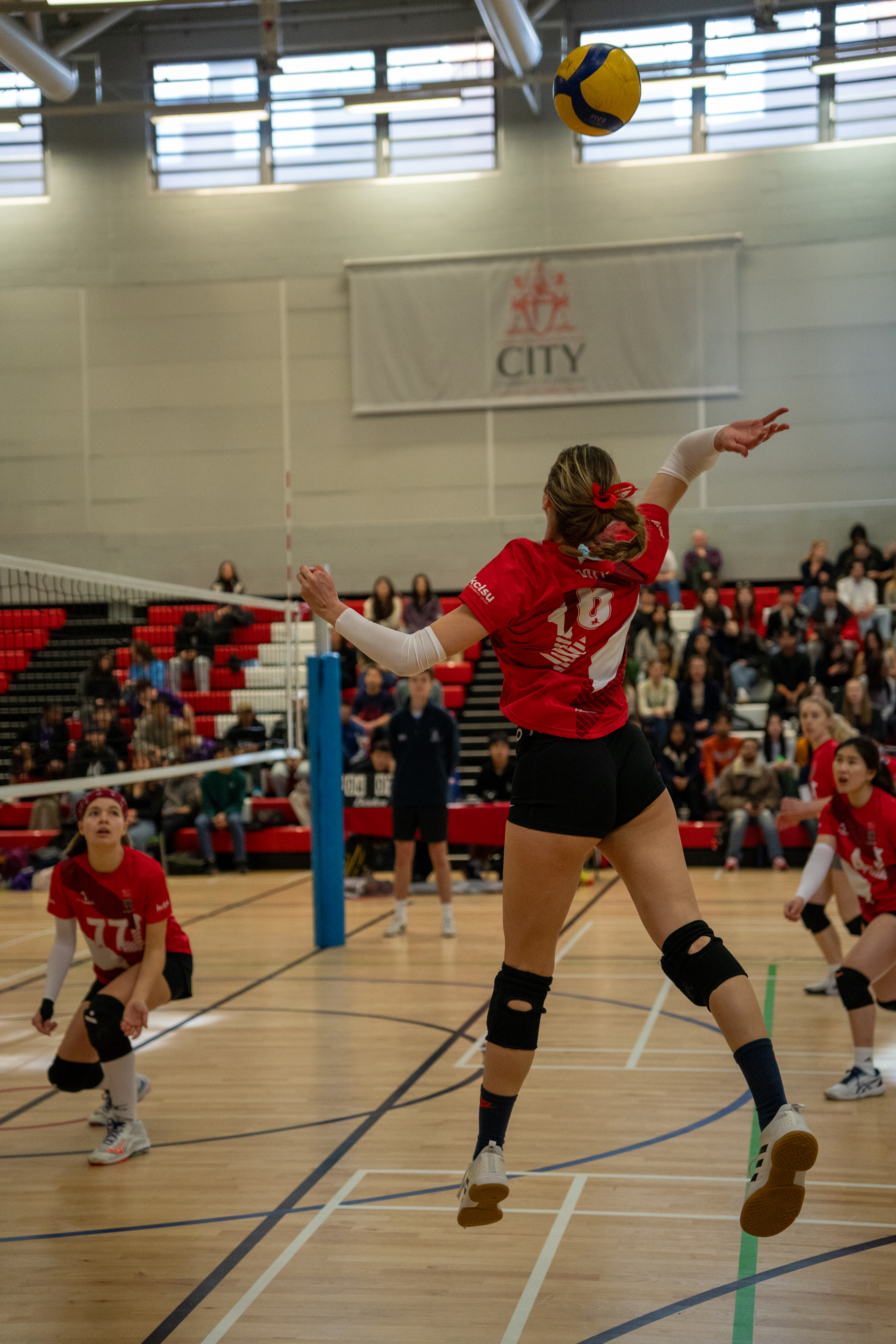Women's volleyball playing at varsity.