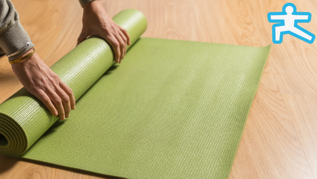 Hands rolling yoga mat