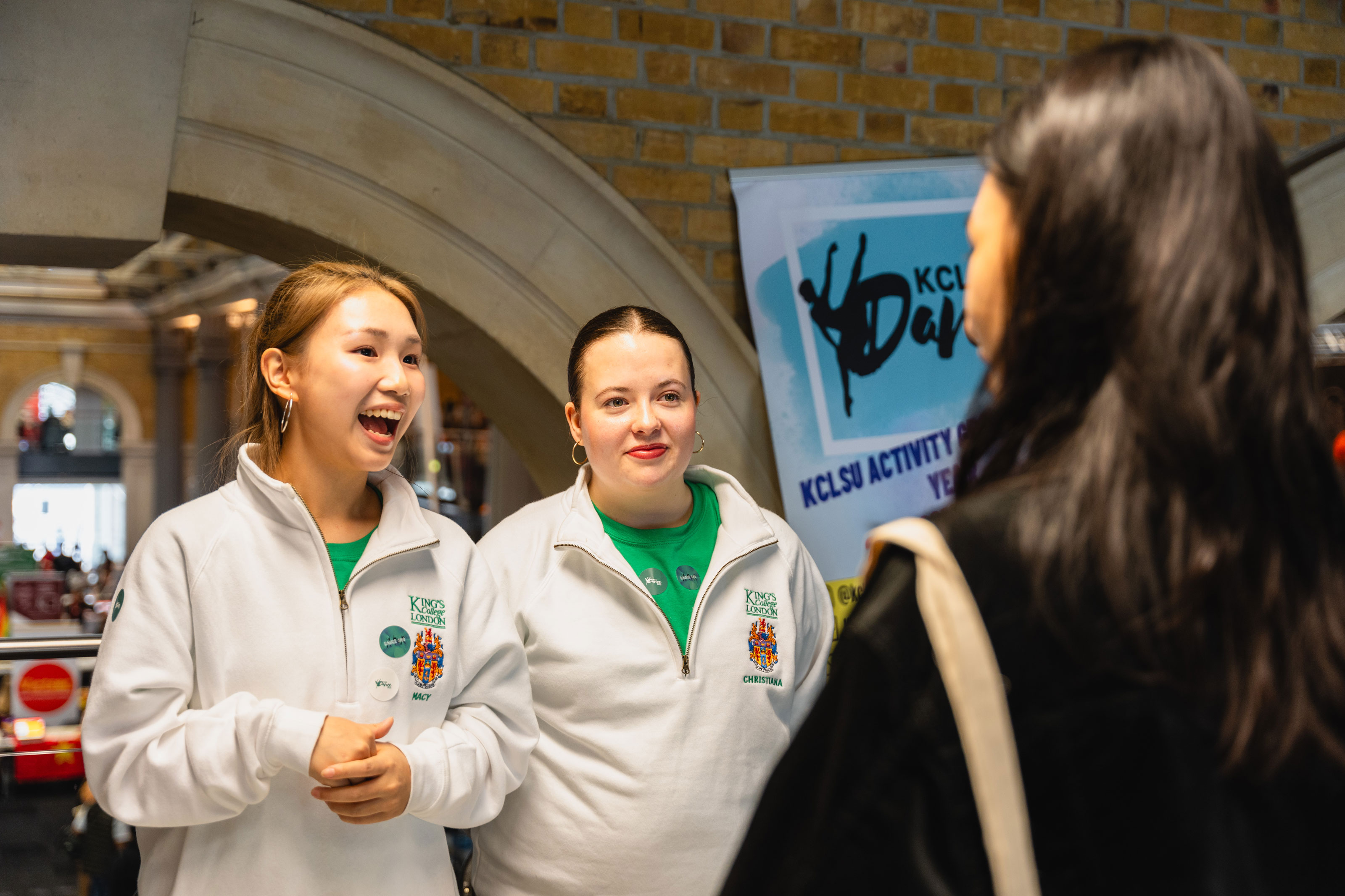 students talking at Welcome Fair