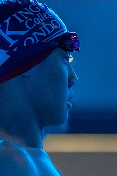 A King's swim team competitor stood by the pool