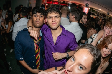 Two friends in Guy's Bar one in a purple shirt, the other in college tie