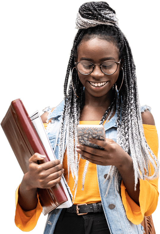 A Black student with dip-dyed grey dreadlocks smiling at their phone